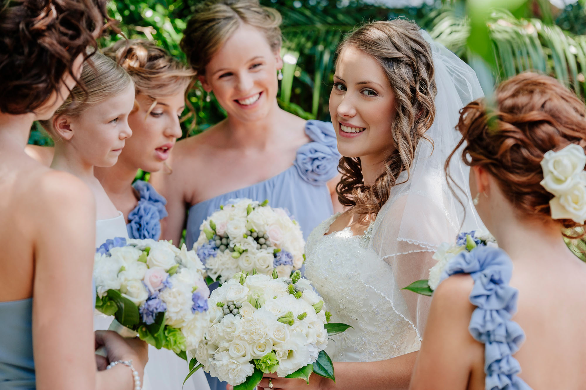 bride surrounded by her bridesmaids