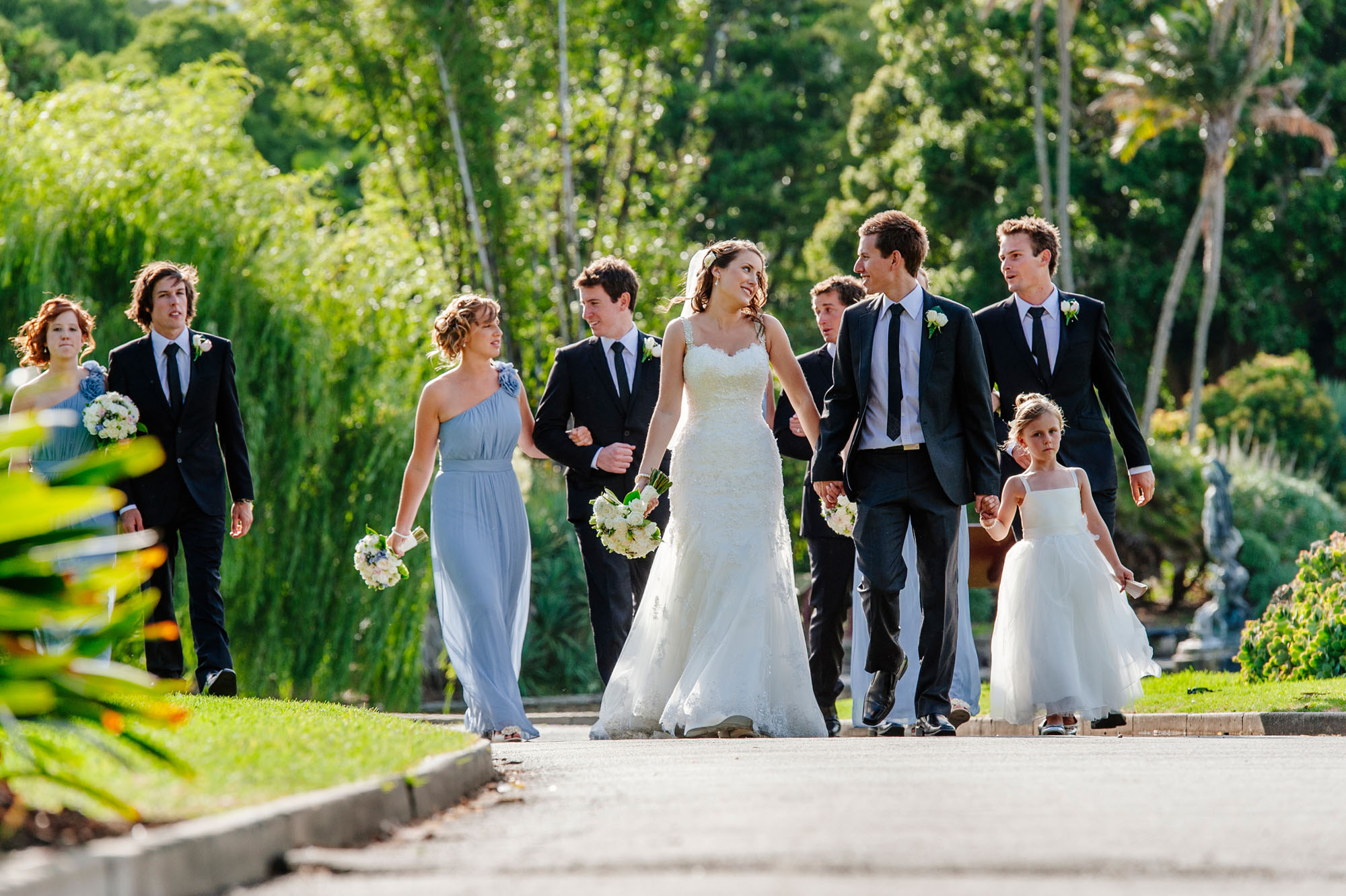 Bridal party walking through the botanic gardens
