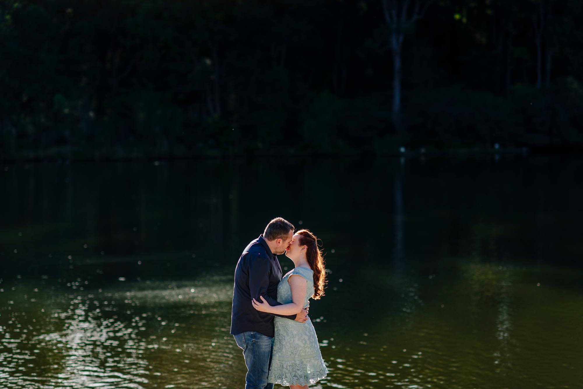 Neil and Emma kiss by Lake parramatta