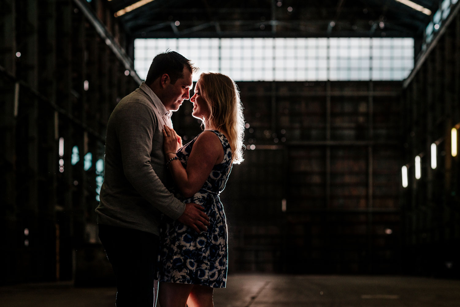 Engagement photos on Rainy Sydney Harbour, taking refuge in warehouse