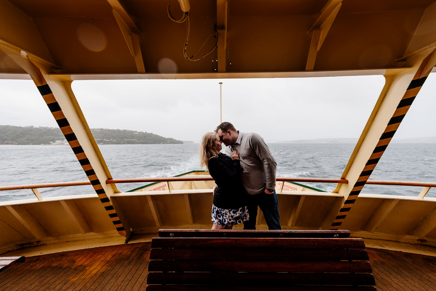 In the rain for engagement photos on Sydney Harbour