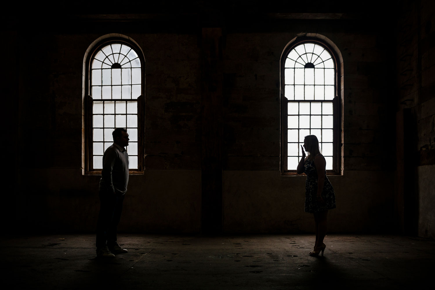 Warehouse silhouette of engaged couple
