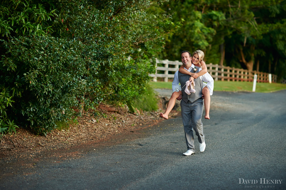 Bride getting piggy back from her groom