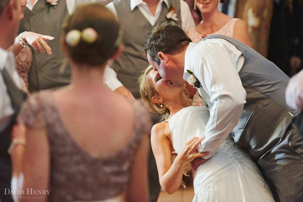 Bride and Groom sneak a kiss on the dance floor