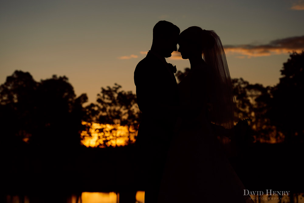 Sunset silhouette of bride and groom in Hunter Valley