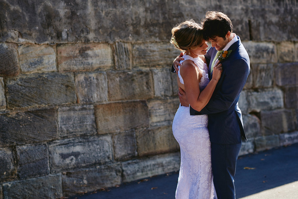 Bride and groom embrace after their wedding ceremony at Observatory Hill