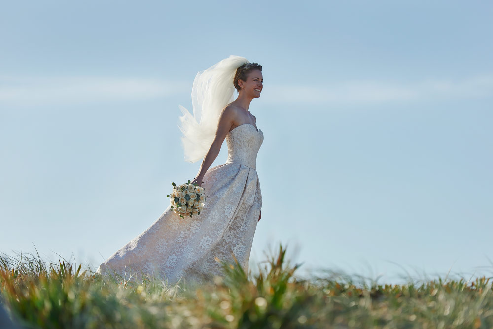 bride in sunshine at nobbys beach