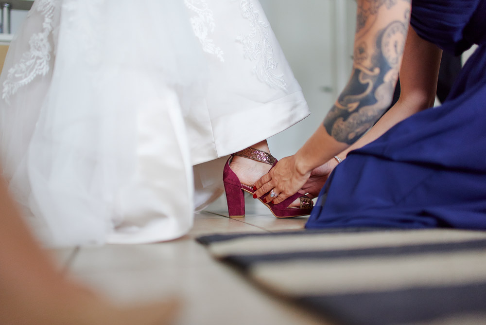 Putting on brides shoes