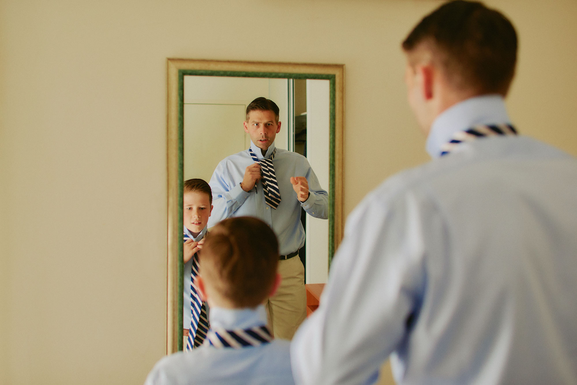Boys putting on their ties