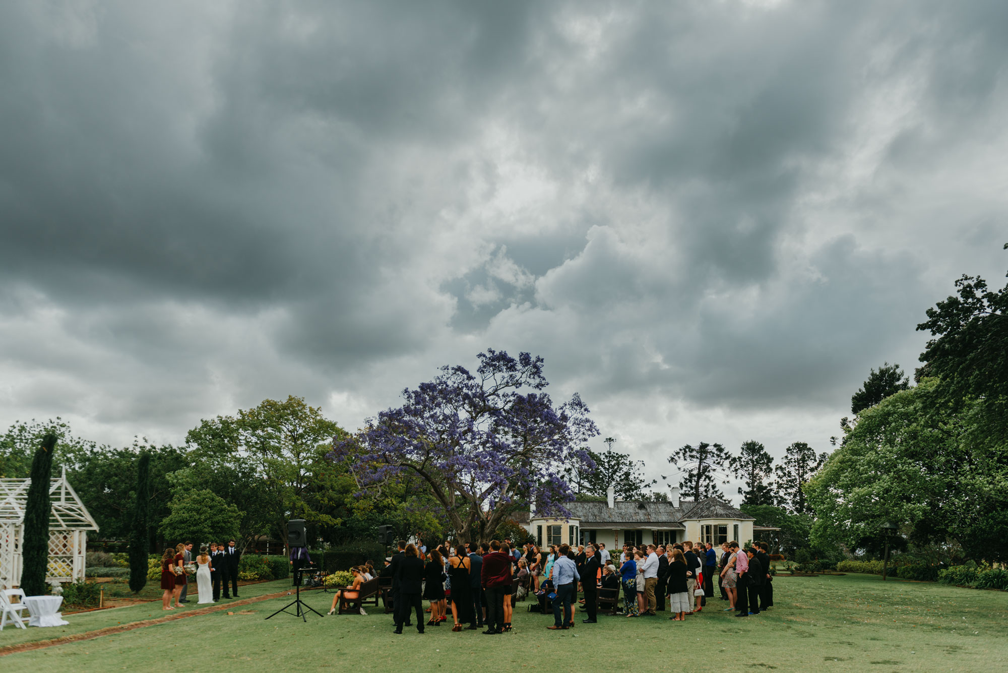 storm clouds gathering overhead the wedding ceremony