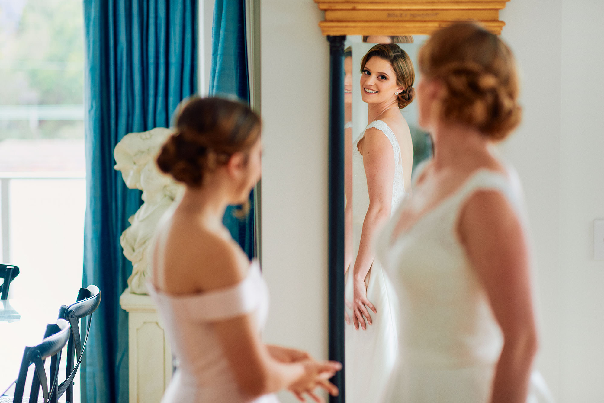 bride admiring her dress