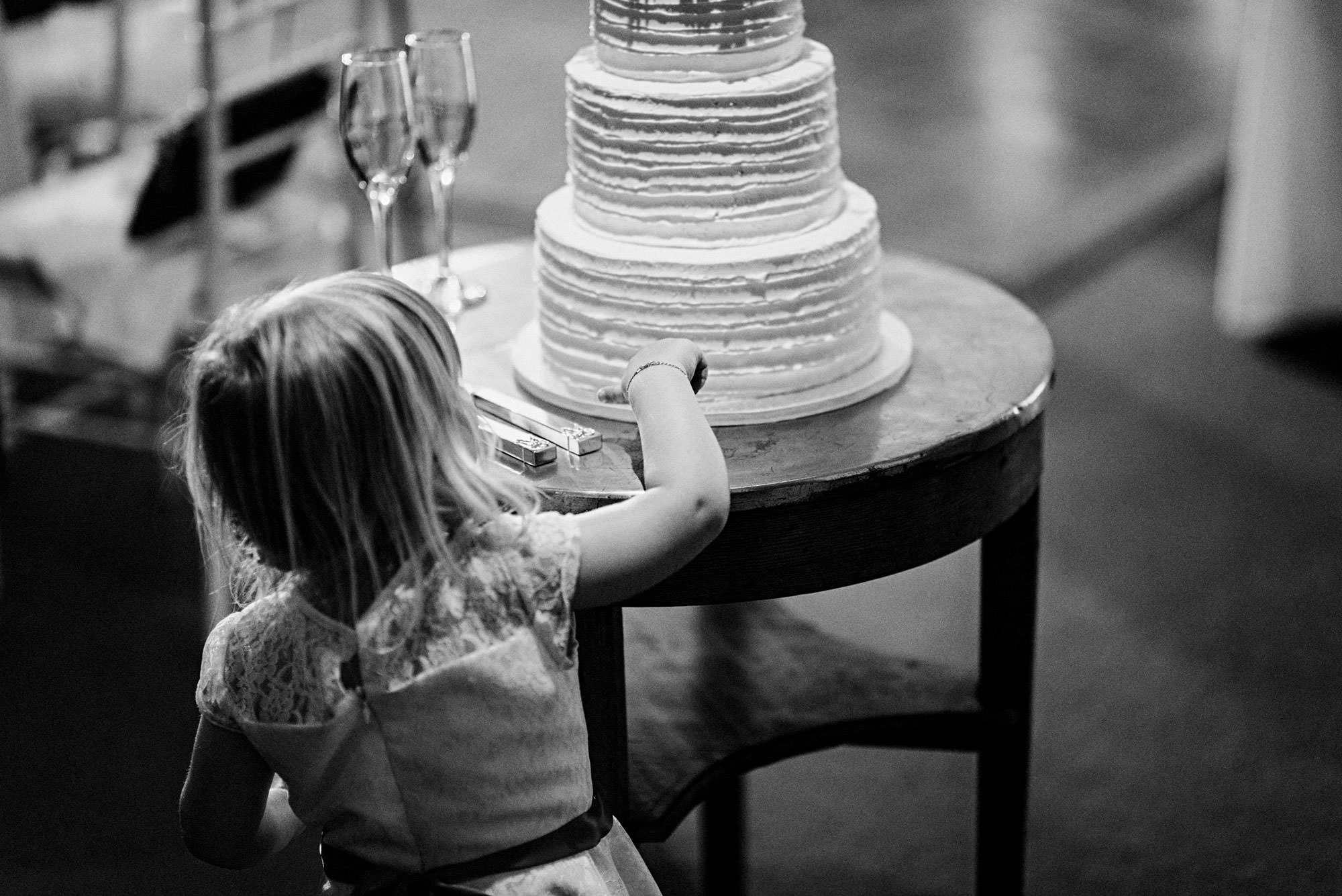 Flowergirl tempted by Wedding Cake