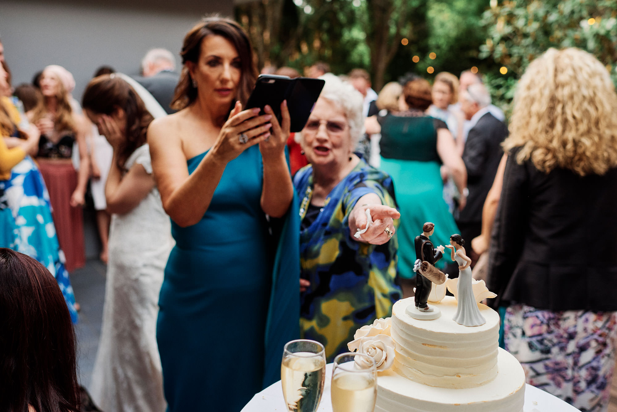 guests admiring the cake