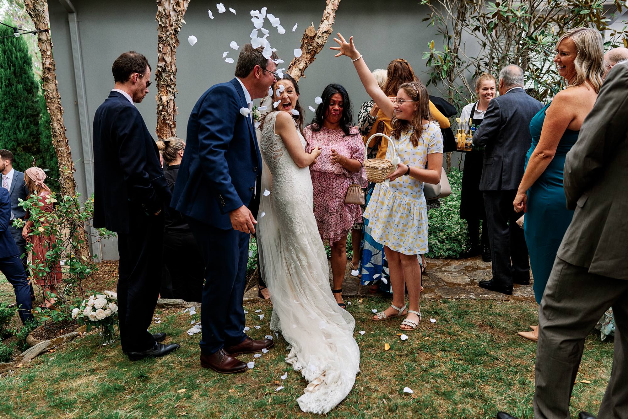 throwing petals over the bridal couple