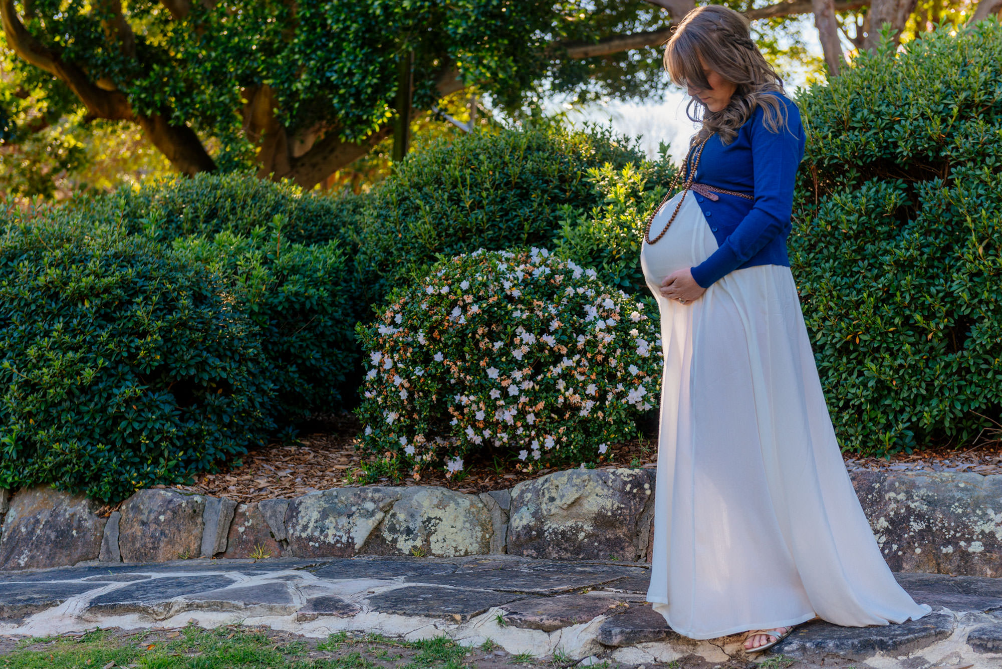 Cradling her baby bump in Wahroonga Park