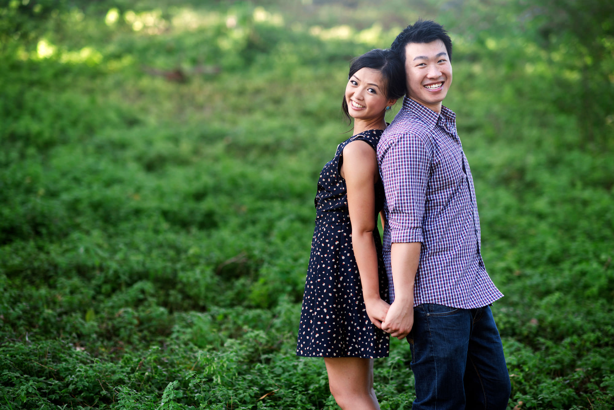 They hold hands in centennial park for their portrait session