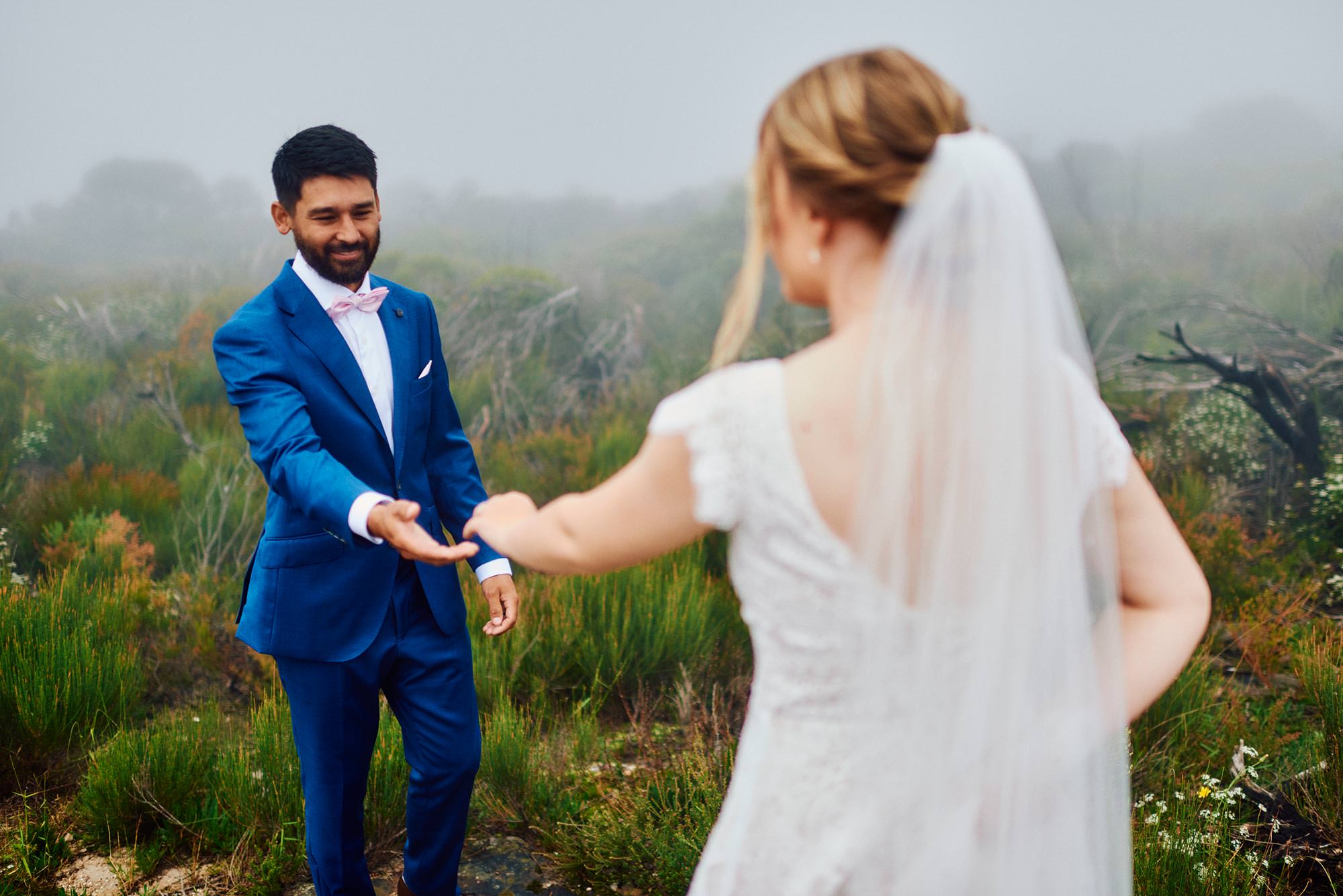 Dancing in the mist of the Blue Mountains on their wedding day