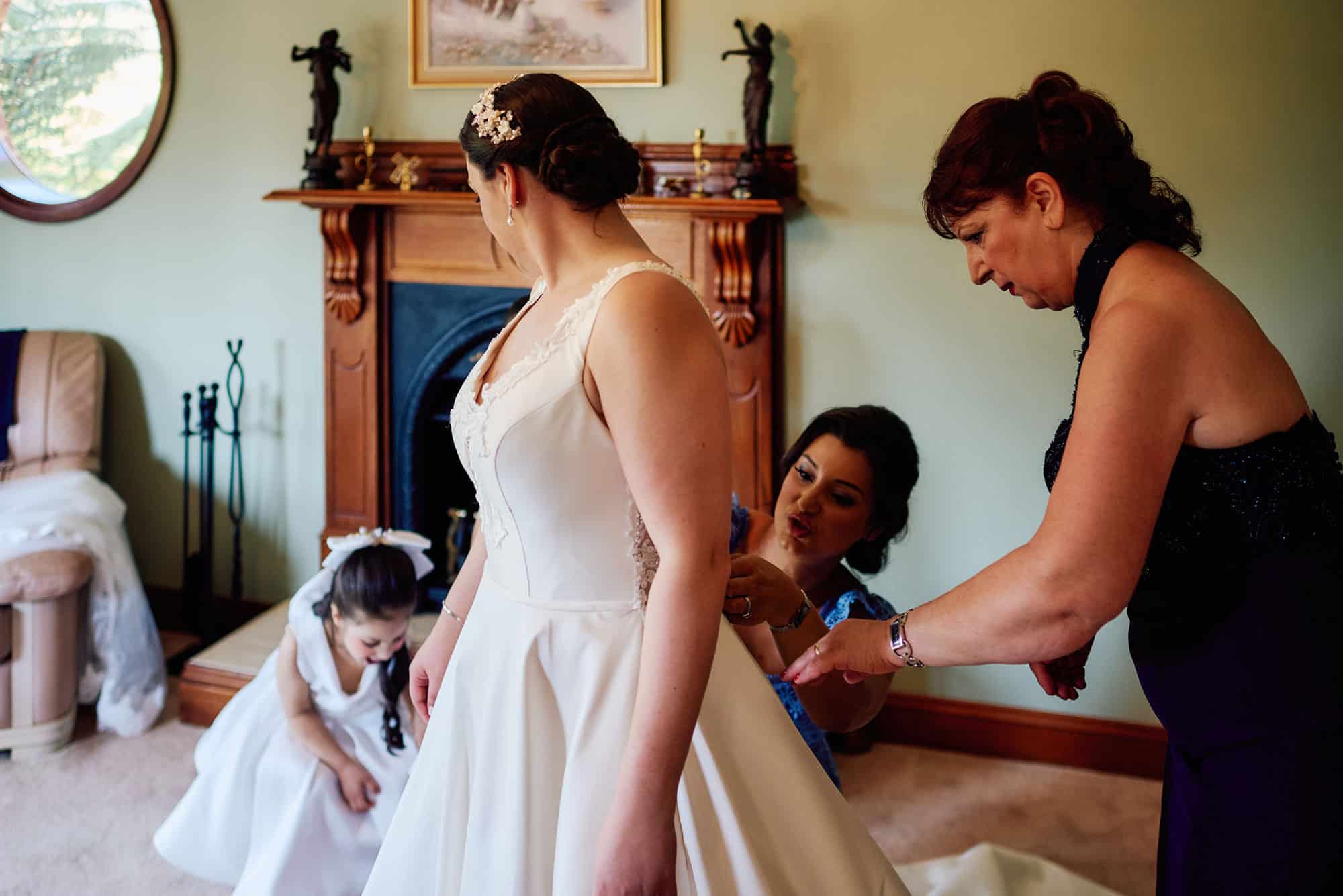 Helping the bride get dressed