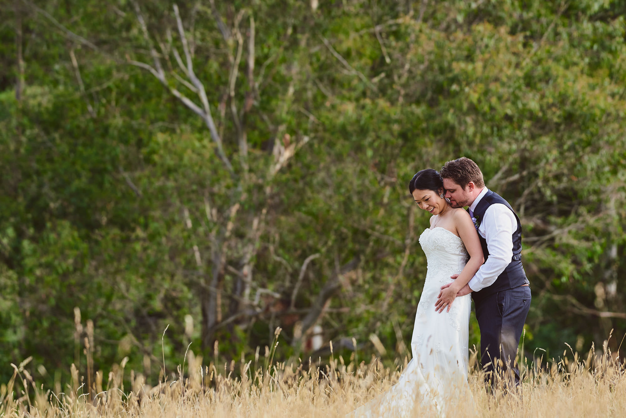 Bride and Groom in long grass