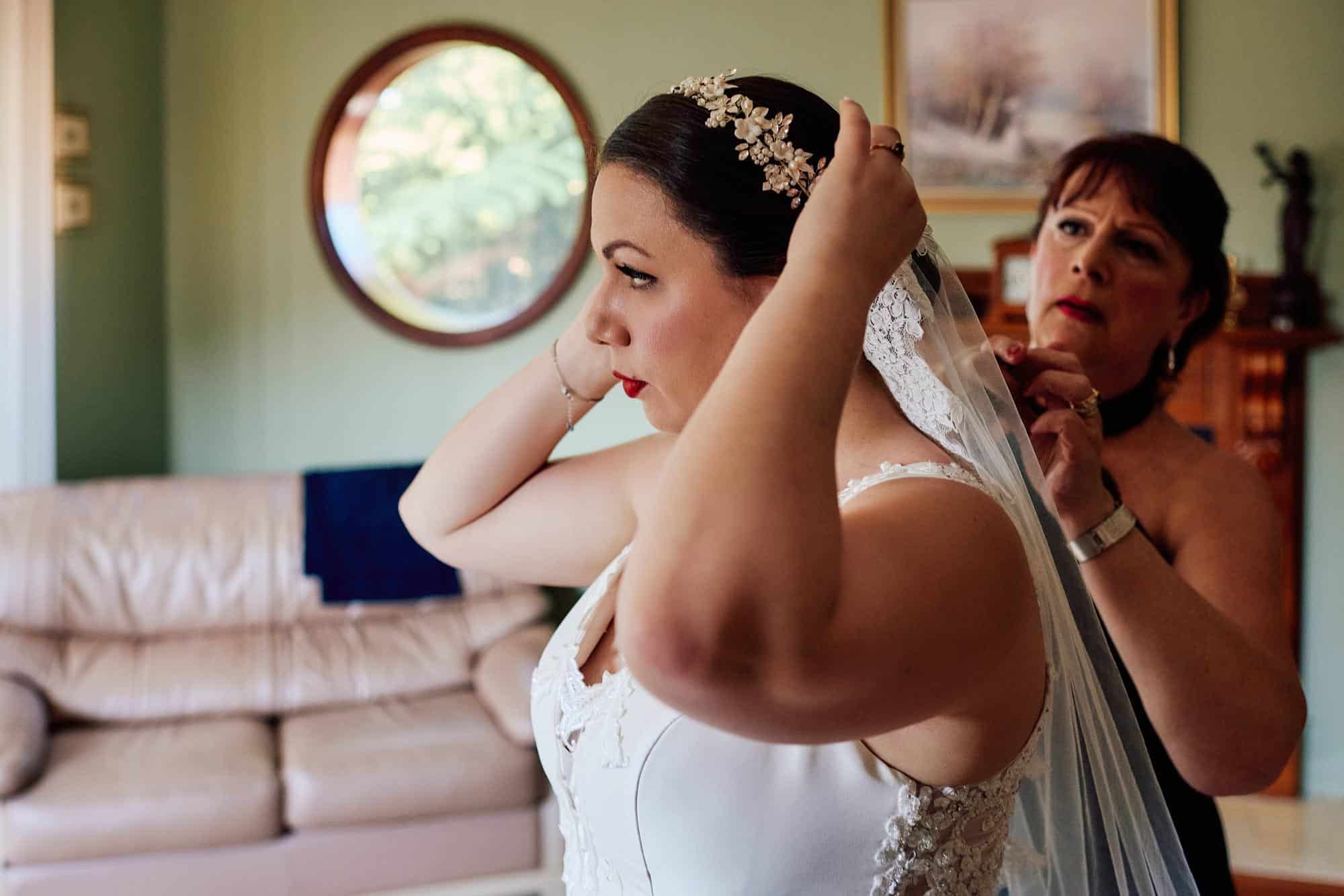 Mum adjusting the brides veil
