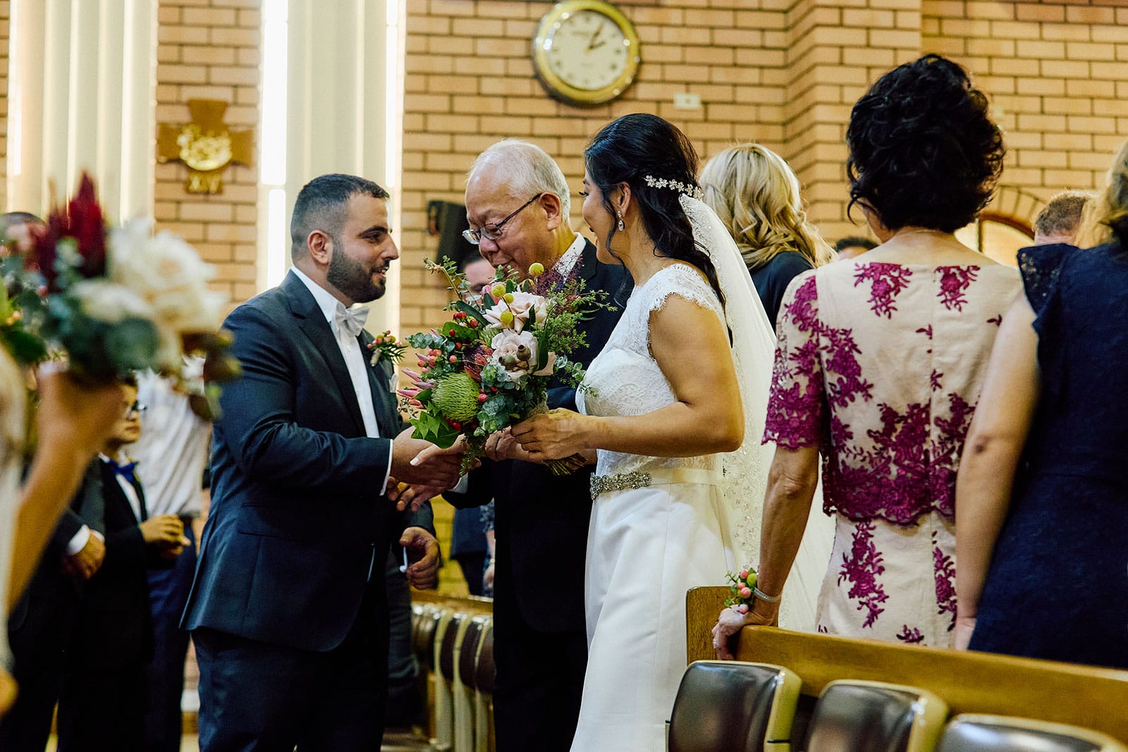 shaking hands with the Father of the Bride