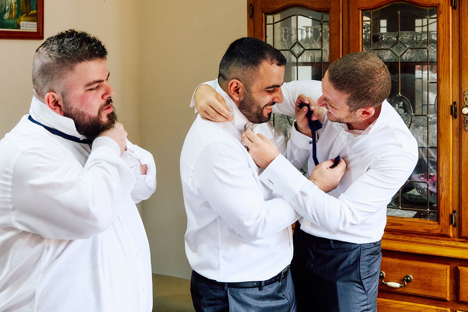the Groom mucking around with his groomsmen